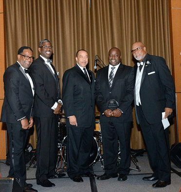 Washington, second from right, was recognized for his contributions to education.