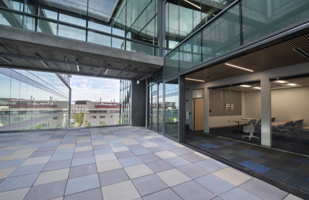 On the fourth floor of the ISEB, large sliding-glass dividers can be opened to create flow between symposium rooms and an outdoor event venue. The design encourages connections between building occupants. Steve Zylius / UCI On the fourth floor of the ISEB, large sliding-glass dividers can be opened to create flow between symposium rooms and an outdoor event venue. The design encourages connections between building occupants. Steve Zylius / UCI