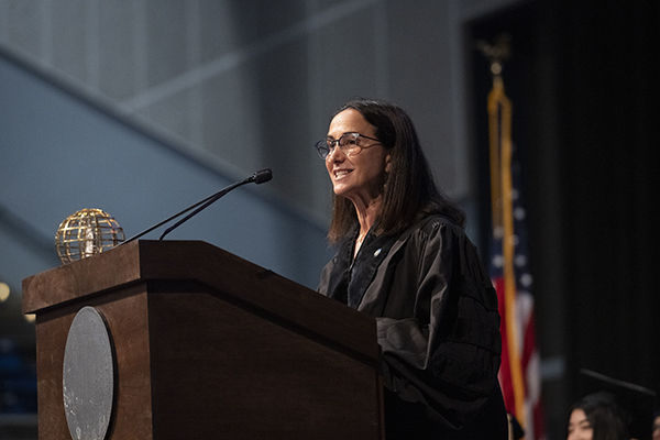 Guest speaker Lindsey Spindle, president of the Samueli Family Philanthropies, told the students “No matter how far you go from the University of California, Irvine, you will remain forever interconnected.” Steve Zylius Guest speaker Lindsey Spindle, president of the Samueli Family Philanthropies, told the students “No matter how far you go from the University of California, Irvine, you will remain forever interconnected.” Steve Zylius