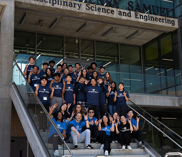 ProperData summer program participants and teaching team Zot in front of UCI’s Interdisciplinary Science and Engineering Building.
