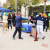 Dean Magnus Egerstedt plays a round of Connect Four at the American Institute of Chemical Engineers booth during the Kickoff Fair. 
