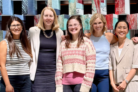 Image of five women posing for a photo.