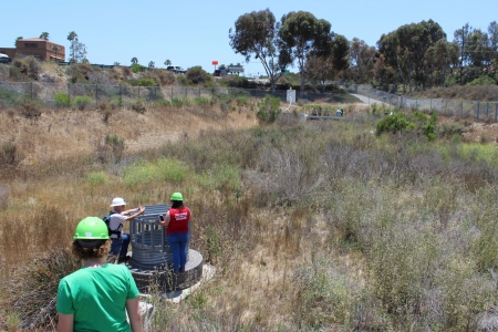 Students and workers inspect a large scale biofilter located in Irvine, CA.