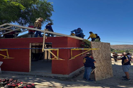 Engineers Without Borders students work alongside other volunteers in Tijuana, Mexico to build a house.