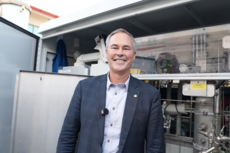 Jack Brouwer, the director of the UCI Clean Energy Institute, in front of the institute’s electrolyzer.
