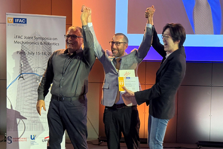 UCI Samueli School of Engineering Dean Magnus Egerstedt (center) is presented with the 2025 Robotics Outstanding Investigator Award by Professors Reza Moheimani, left, (UT Dallas) and Kyoungchul Kong (KAIST), IFAC Awards Committee chairs.