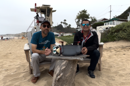 Dean Magnus Egerstedt and UCI researcher Efrain Mendez present the RaccoonBot at Crystal Cove State Park.