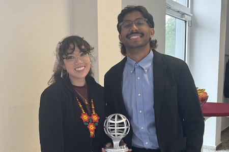 UCI materials science and engineering graduate students Raquel Fierro Jaime and Shrivatsav Shankar celebrate being final presenters at the WFO Conference in Germany on June 11, 2024.